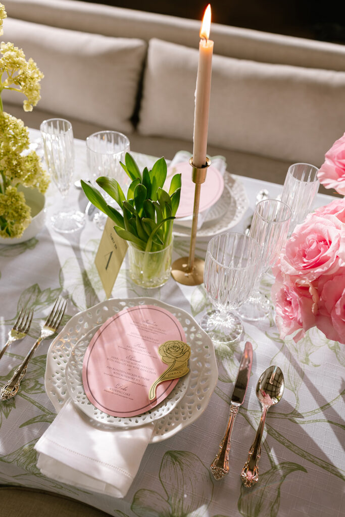 Tablescapes crystal Park Lane glassware reflecting window light next to a romantic blush rose arrangement.